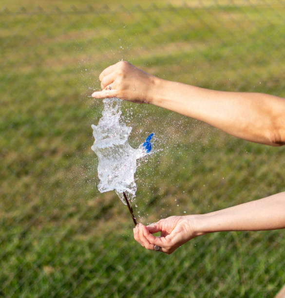 istock A small water balloon being popped with a nail 1299188503