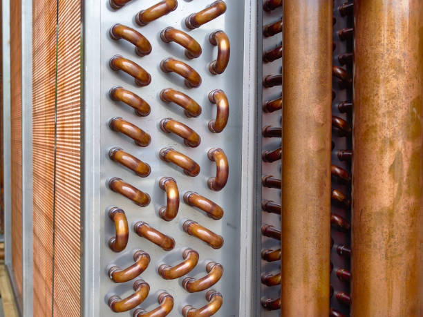 Close shot of copper plain tubes of a condenser coil. Close shot of copper plain tubes of a condenser coil for HVAC System. condenser stock pictures, royalty-free photos & images