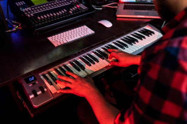 istock White man compositor is playing on keyboard in the record studio for radio fm 1299192957