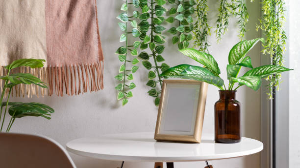 istock Biophilia leisure corner with mock up frame, coffee table and houseplants 1299198435