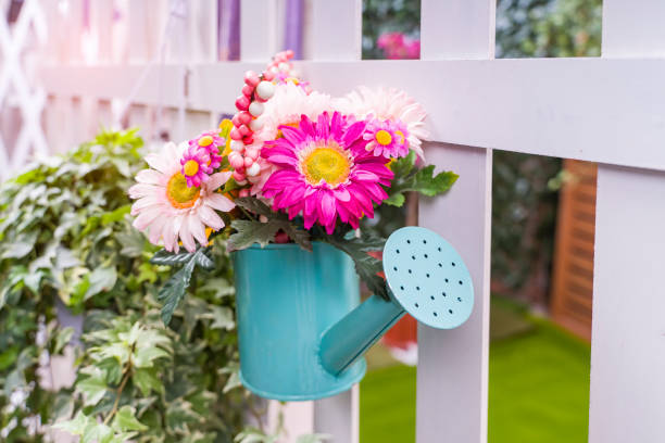istock Hanging Flower Pots with fence 1299203370
