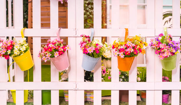 istock Hanging Flower Pots with fence 1299207507