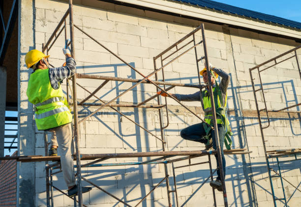 istock Professional worker wearing safety harness and safety line working on scaffolding. 1299210504