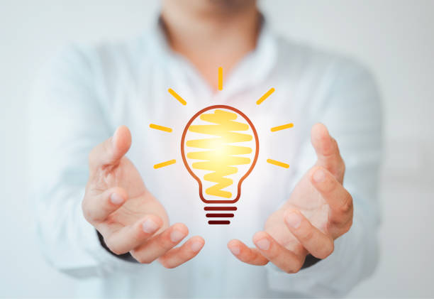istock Businessman holding virtual lightbulb ,creative idea and innovation concept. 1299221158
