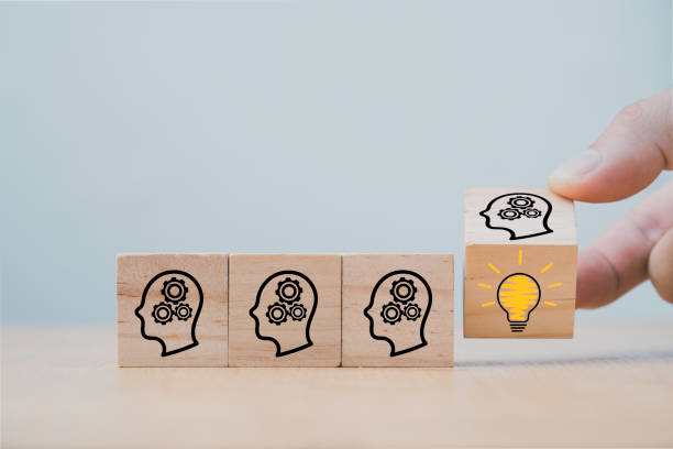 istock Hand flipping wooden cube block which print screen face with questions mark to lightbulb, creative idea and innovation concept. 1299221485