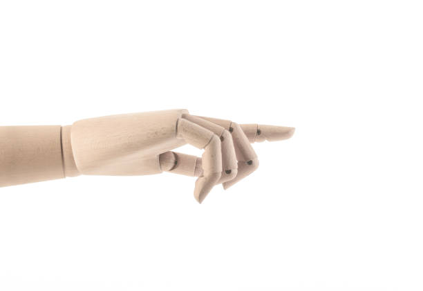 istock Wooden hand pointing finger 1299222533