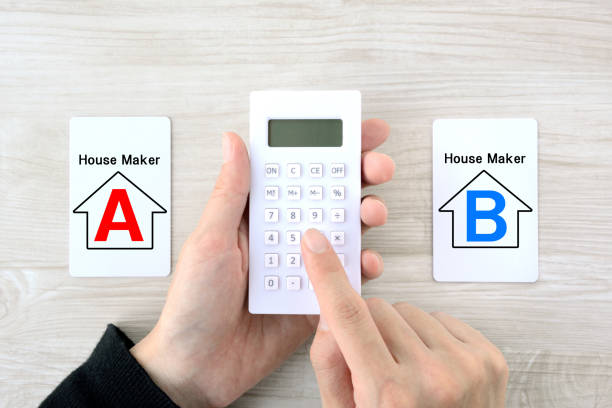 istock Human's hands using calculator to decide which housing company is better 1299223203