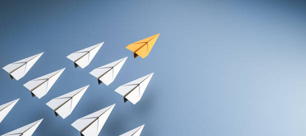 istock Leadership concept, yellow leader plane leading white planes, on blue background with empty copy space on right side 1299226775