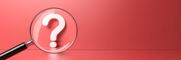 istock White question mark with magnifying glass on red background and empty copy space on right side, FAQ Concept 1299226789
