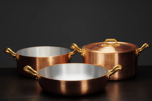 istock Shiny vintage copper cookware over dark background 1299226842