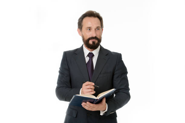 istock Businessman planning business schedule with notepad. Time management and organizing skill. Man bearded manager face create plan. Successful businessman planning isolated white. Office manager wanted 1299227597