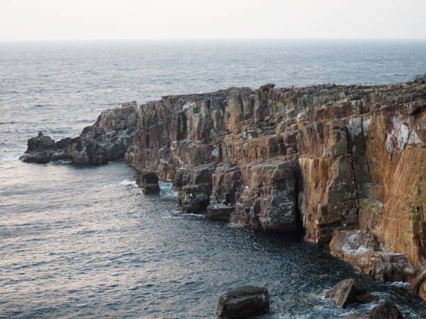istock Rocky cliff along the coast 1299227898