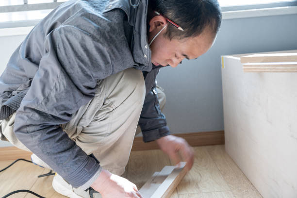 istock A craftsman who moves into his new apartment and is assembling cabinets 1299233722