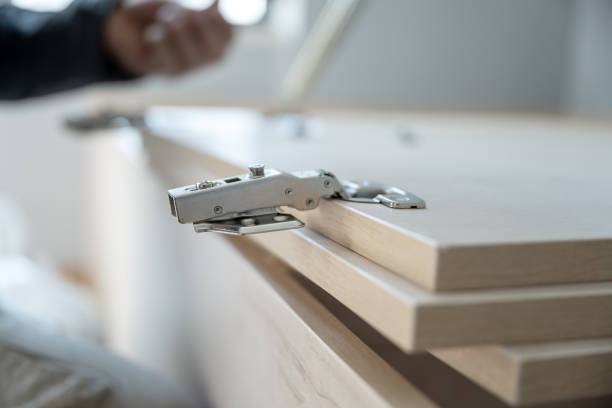 A hardworking craftsman who moved into his new apartment and was assembling cabinets