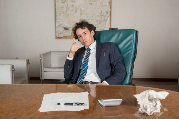 istock young businessman in his office at phone 1299235434