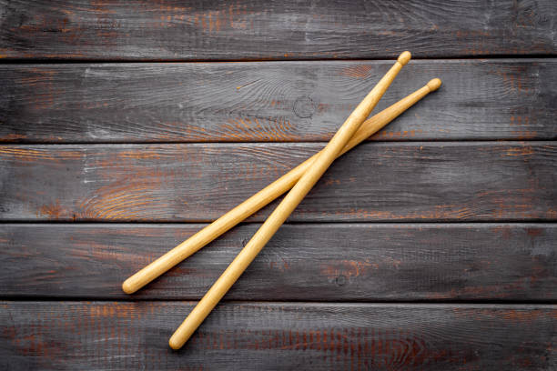 istock Two wooden drum sticks, top view. Music background 1299235635