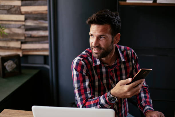 istock Company manager on his phone sending a message. 1299238057