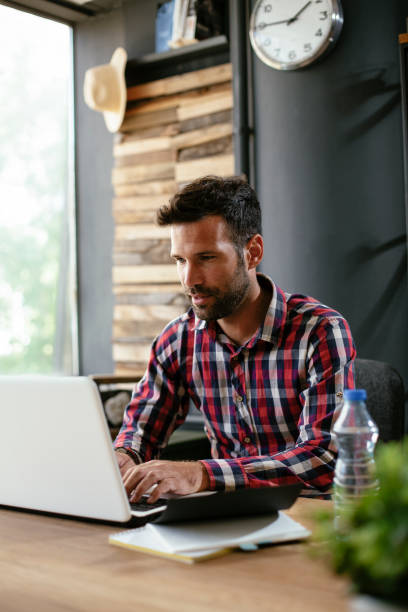 istock Businessman working in the office on his laptop. 1299238125