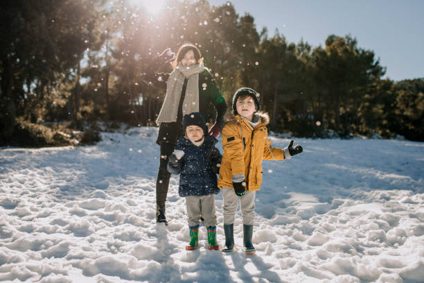 istock Family having fun on a snowy landscape 1299239239
