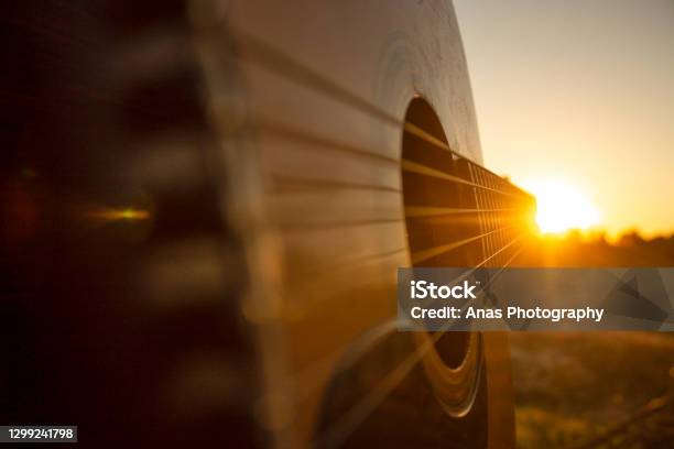 Playing Guitar During The Sunset With Some Friends Stock Photo - Download Image Now