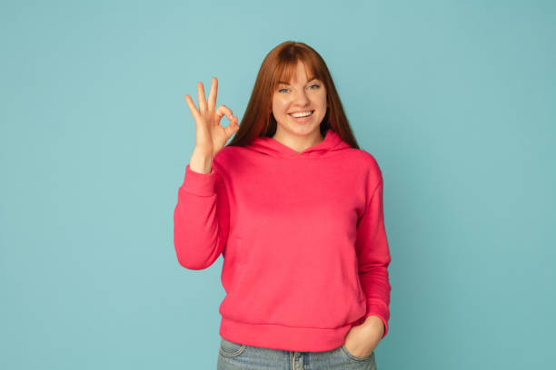 istock Caucasian woman's portrait isolated on blue studio background with copyspace 1299242955