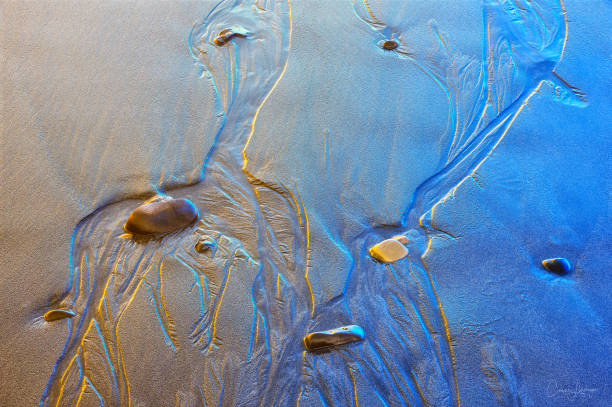 istock stone abstraction sand and water at low tide 1299243472