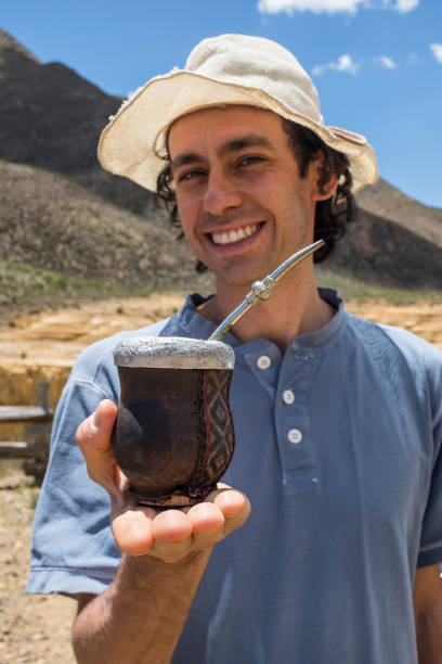 istock young man drinking mate in Argentina 1299243595