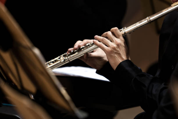 istock Hands of a musician playing the flute 1299244257