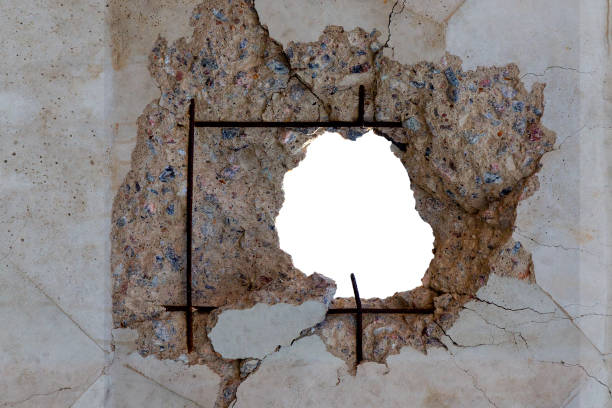 istock Large hole in reinforced concrete wal 1299244439