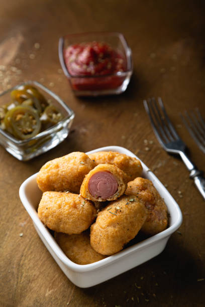 istock Mini corn dog with ketchup and jalapeno pepper 1299244466