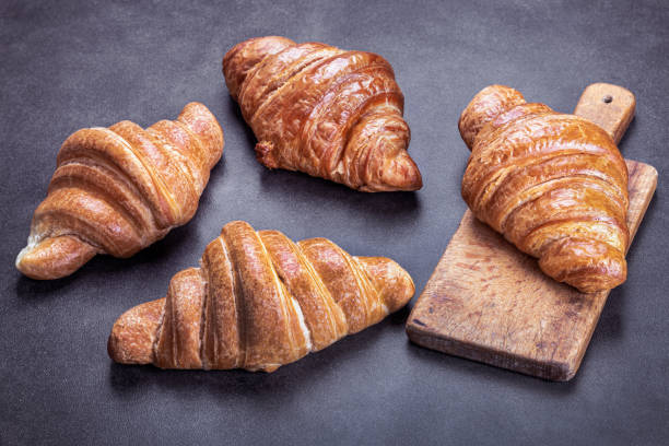 istock croissants lie on the black breakfast table 1299244599