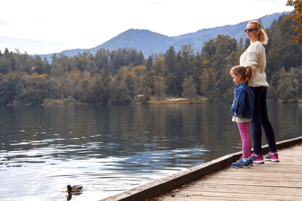 istock Mother and daughter having a good time on a lake. 1299245479