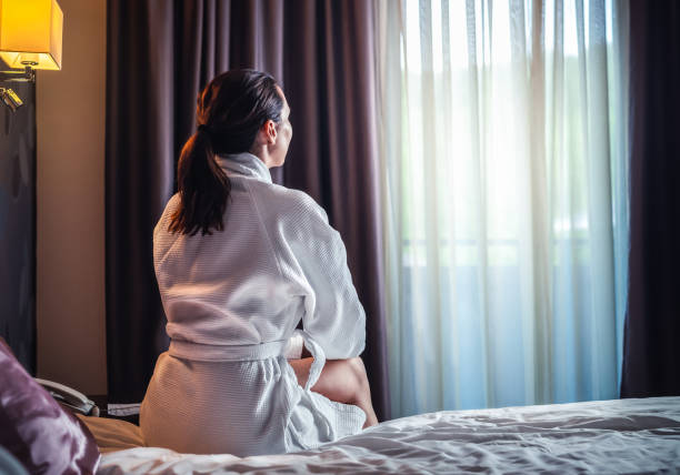 istock Woman in hotel room 1299245894