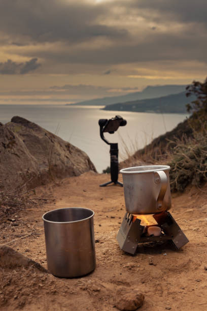 istock Iron, tourist mugs on an open fire during a camping trip 1299248319
