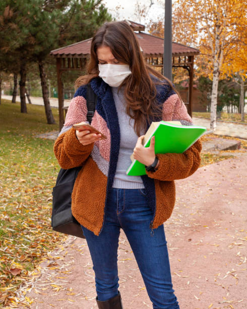 istock A young university student is waiting for her friends. 1299252336