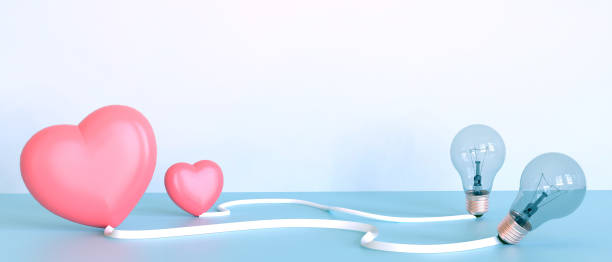 istock idea Creative Valentine's day in love and Bulb light with Two pink Heart inspiration concept on Blue Background. Copy space,design for banner - 3d rendering 1299253247