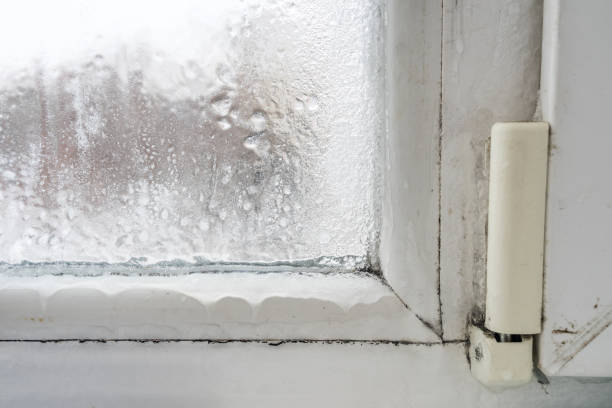 istock Close up of a defective plastic window with condensation and freezing inside. Poor ventilation, high humidity and temperature differences. 1299253490