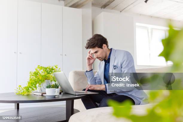 Businessman Working On Laptop In The Green Office Stock Photo - Download Image Now - 30-39 Years, Adult, Adults Only