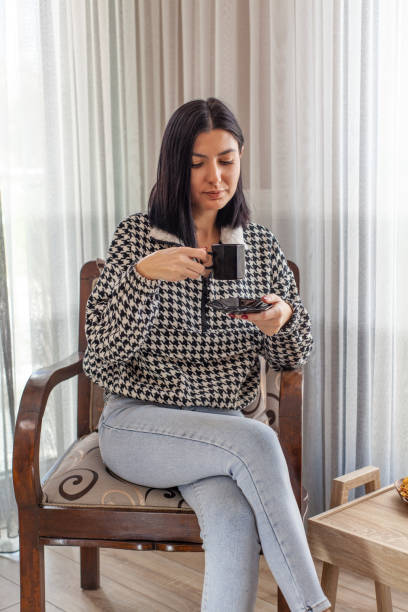 istock A young woman is enjoying her coffee. 1299253619