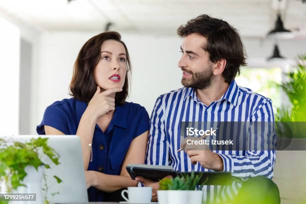 Coworkers Working In The Ecofriendly Green Office Stock Photo - Download Image Now - 30-39 Years, Adult, Adults Only