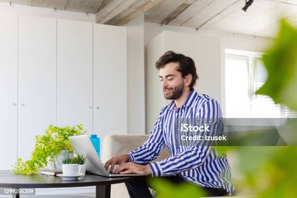 Man Working In The Ecofriendly Green Office Stock Photo - Download Image Now - Men, Office, Water Bottle
