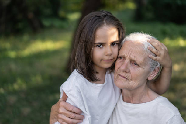 istock Affectionate granddaughter and grandmother are hugging. 1299256769