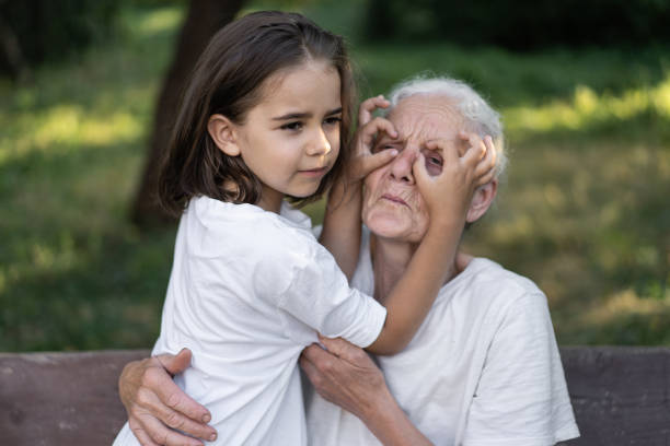Affectionate granddaughter and grandmother are hugging.