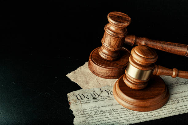 istock Brown wooden mallet on American Declaration of Independence 1299256798