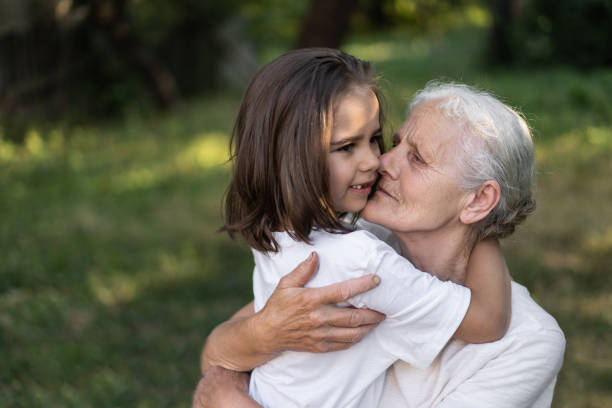 istock Affectionate granddaughter and grandmother are hugging. 1299256799
