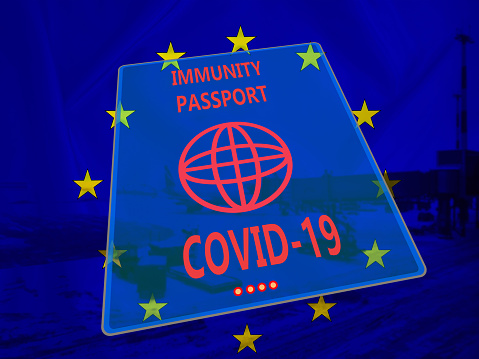 Immune passport on background of EU flag. Certificate confirms vaccination against covid-19. Vaccination document due to covid-19.