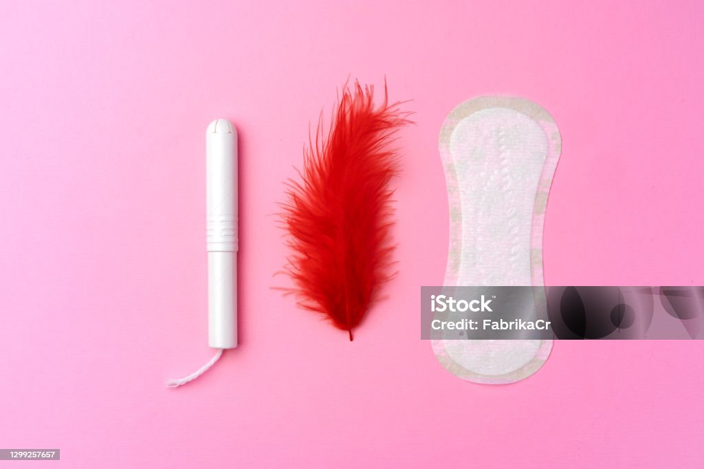 Female hygienic pad and tampons on pink background Female hygienic pad and tampons on pink background top view Sanitary Pad Stock Photo