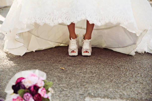 istock Shiny shoes of a bride 1299258348