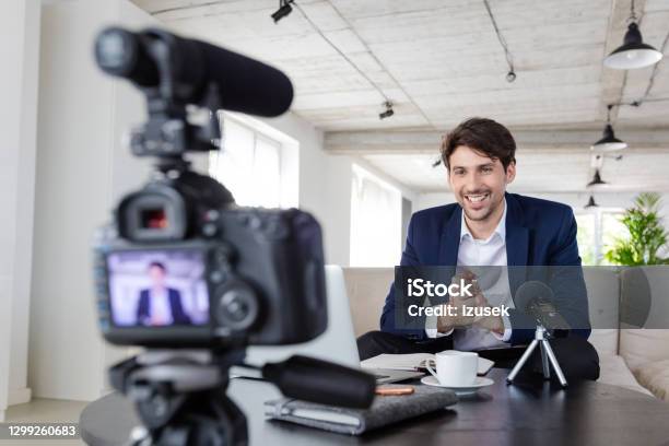 Businessman Making A Video Blog In The Office Stock Photo - Download Image Now - Elegance, Filming, Men
