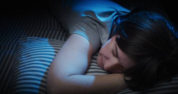 istock Mature woman sleeping in bed 1299261949
